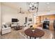 Open-concept living room and kitchen with stainless steel appliances and a breakfast nook at 4102 E Cathedral Rock Dr, Phoenix, AZ 85044
