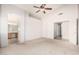 Large carpeted main bedroom featuring vaulted ceiling, ceiling fan, and arched doorways at 4102 E Cathedral Rock Dr, Phoenix, AZ 85044