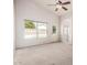 Bright, carpeted main bedroom with high ceilings, ceiling fan, and backyard views at 4102 E Cathedral Rock Dr, Phoenix, AZ 85044