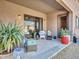Relaxing back patio with comfortable seating, decorative plants, and covered space at 4241 N Pebble Creek Pkwy # 42, Goodyear, AZ 85395