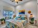 Cozy bedroom with a ceiling fan and beach-themed decor, creating a relaxing retreat at 4241 N Pebble Creek Pkwy # 42, Goodyear, AZ 85395