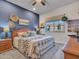 Comfortable bedroom with a large window, soft carpet, and stylish decor at 4241 N Pebble Creek Pkwy # 42, Goodyear, AZ 85395