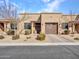 Charming single-story home featuring a well-manicured yard and a welcoming front entrance with a brown garage door at 4241 N Pebble Creek Pkwy # 42, Goodyear, AZ 85395