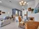 Open-concept living space with a combined living room, dining area and kitchen at 4241 N Pebble Creek Pkwy # 42, Goodyear, AZ 85395