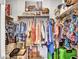 Organized walk-in closet with shelving and hanging space, providing ample storage at 4241 N Pebble Creek Pkwy # 42, Goodyear, AZ 85395