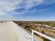 An expansive rooftop view showcases the surrounding area and clear blue skies, with railings for safety at 4750 N Central Ave # 7D, Phoenix, AZ 85012