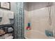 Well-lit bathtub and shower with bright blue accents, plus a matching towel set at 5450 E Mclellan Rd # G227, Mesa, AZ 85205