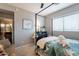 Well-lit bedroom featuring a four-poster bed, dark finishes, and a sunny window at 5450 E Mclellan Rd # G227, Mesa, AZ 85205
