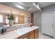 Well-lit kitchen with a double sink, tile flooring, and direct access to the dining area at 5450 E Mclellan Rd # G227, Mesa, AZ 85205