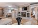 Stylish living room with built-in shelving, modern decor, and an open layout to the kitchen and hallway at 5450 E Mclellan Rd # G227, Mesa, AZ 85205