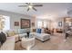Spacious living room blending seamlessly with the dining area, featuring a large sectional and modern decor at 5450 E Mclellan Rd # G227, Mesa, AZ 85205