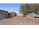 Spacious backyard featuring a block wall, chain link fence, and gravel groundcover at 606 E Baseline Rd, Buckeye, AZ 85326