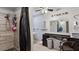 Spacious bathroom with a tiled shower and ample storage space at 606 E Baseline Rd, Buckeye, AZ 85326