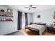 Inviting bedroom with hardwood floors, blue walls, and natural light at 606 E Baseline Rd, Buckeye, AZ 85326