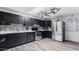 Stylish kitchen with dark cabinets, modern appliances, and a sleek backsplash design at 606 E Baseline Rd, Buckeye, AZ 85326