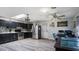Modern kitchen with stainless steel appliances, ample counter space, and an adjacent dining area at 606 E Baseline Rd, Buckeye, AZ 85326