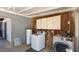 Practical laundry room setup with washer, dryer, and built-in storage at 606 E Baseline Rd, Buckeye, AZ 85326