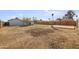 Large backyard with potential for landscaping and outdoor activities on a sunny day at 7160 W Virginia Ave, Phoenix, AZ 85035