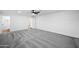 Spacious bedroom with carpet, a ceiling fan, and access to an adjacent bathroom at 7160 W Virginia Ave, Phoenix, AZ 85035
