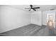 Bedroom with carpet, ceiling fan, closet, and access to other rooms at 7160 W Virginia Ave, Phoenix, AZ 85035
