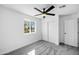 Bedroom featuring carpet, a ceiling fan, a window, and a closet at 7160 W Virginia Ave, Phoenix, AZ 85035