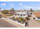Charming single-story home featuring manicured landscaping and a decorative fence at 7160 W Virginia Ave, Phoenix, AZ 85035
