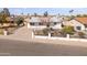 Well-maintained single-story home with a manicured front yard and secure fencing at 7160 W Virginia Ave, Phoenix, AZ 85035