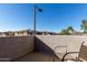 Relaxing balcony area with chair, overlooking neighborhood and nearby buildings at 7726 E Baseline Rd # 207, Mesa, AZ 85209