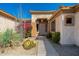 Inviting front entrance featuring desert landscaping and a charming covered entryway at 7776 E Sands Dr, Scottsdale, AZ 85255