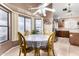 Bright dining nook featuring large windows and a ceiling fan at 9014 E Sharon Dr, Scottsdale, AZ 85260