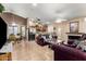 Cozy living area featuring tile flooring, fireplace, and open access to the kitchen at 9014 E Sharon Dr, Scottsdale, AZ 85260