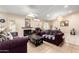 Inviting living room featuring tile flooring, fireplace, and a comfortable seating area at 9014 E Sharon Dr, Scottsdale, AZ 85260