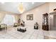 Bright living room with tiled floors, a chandelier, and a decorative display case at 9014 E Sharon Dr, Scottsdale, AZ 85260