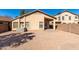 Gravel backyard with a built in BBQ, and block wall fencing at 911 E Lovegrass Dr, San Tan Valley, AZ 85143