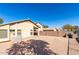 Gravel backyard with a built in BBQ, and block wall fencing at 911 E Lovegrass Dr, San Tan Valley, AZ 85143