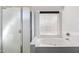 Bathroom featuring a soaking tub, separate shower, and bright natural light offers a relaxing and spa-like feel at 911 E Lovegrass Dr, San Tan Valley, AZ 85143