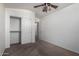 Neutral bedroom featuring closet with sliding doors and a ceiling fan at 911 E Lovegrass Dr, San Tan Valley, AZ 85143