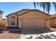 Inviting single-story home featuring a well-maintained exterior, tile roof and a two-car garage at 911 E Lovegrass Dr, San Tan Valley, AZ 85143
