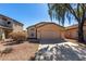 Charming single-story home with low-maintenance landscaping, tile roof and two car garage at 911 E Lovegrass Dr, San Tan Valley, AZ 85143