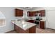 A modern kitchen featuring granite countertops, stainless steel appliances, and well-crafted wooden cabinets at 911 E Lovegrass Dr, San Tan Valley, AZ 85143