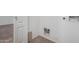 Laundry area shows tile flooring, utility hookups, and a doorframe at 911 E Lovegrass Dr, San Tan Valley, AZ 85143