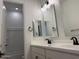 Bathroom featuring double vanity, and a large mirror at 10027 W Verde Ln, Avondale, AZ 85392