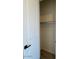 Bright closet featuring painted walls, wood plank flooring, and a rod for hanging garments at 10027 W Verde Ln, Avondale, AZ 85392