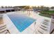 Resort-style community pool with sun loungers for hours of relaxation and fun at 10027 W Verde Ln, Avondale, AZ 85392