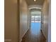 Hallway featuring painted walls and light-colored wood plank flooring at 10027 W Verde Ln, Avondale, AZ 85392
