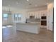 Open-concept kitchen features a large island, modern appliances, and ample counter space at 10027 W Verde Ln, Avondale, AZ 85392