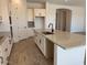 Spacious kitchen island with granite countertop and stainless steel sink at 10027 W Verde Ln, Avondale, AZ 85392