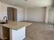 Open living room with views into dining room, hardwood floors, and recessed lighting at 10027 W Verde Ln, Avondale, AZ 85392