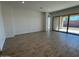 Open living room with large sliding glass doors to the outdoor patio at 10027 W Verde Ln, Avondale, AZ 85392