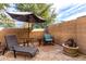 This backyard with stone floors, a fence, and patio furniture at 1015 S Val Vista Dr # 81, Mesa, AZ 85204